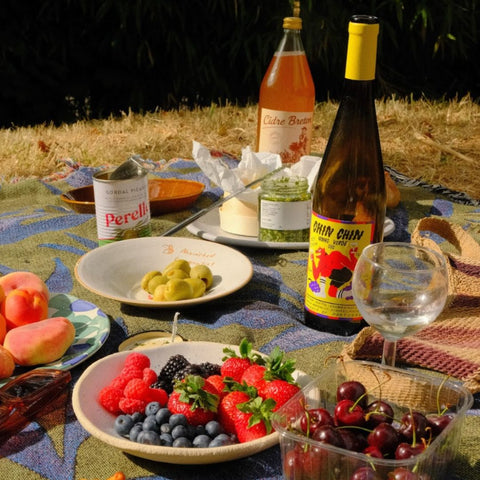 chin chin vinho verde noble rot bottle at a picnic with fruits