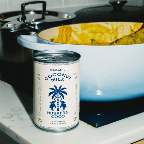 huskers coco coconut milk - 400ml in front of a pan