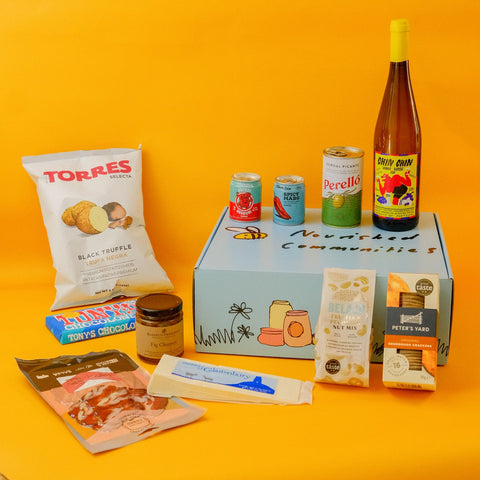 Picnic products on a hamper box with a yellow background