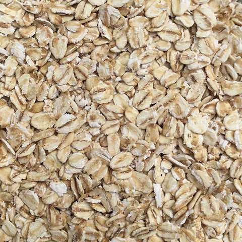 Close-up of rolled oats with a brownish color.