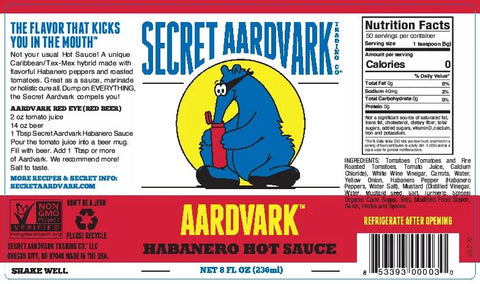 Front and back packaging of Secret Aardvark Habanero Hot Sauce, showing the blue cartoon aardvark logo, red and white background, nutrition facts, ingredients, and shaking instructions.