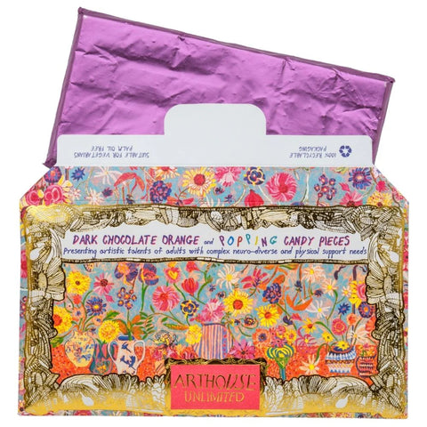 Colorful box of Arthouse Unlimited dark chocolate orange and popping candy pieces with a floral design.