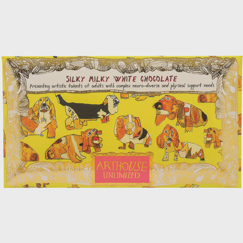 Silky Milky White Chocolate bar with animal illustrations and ArtHouse Unlimited branding on a yellow background