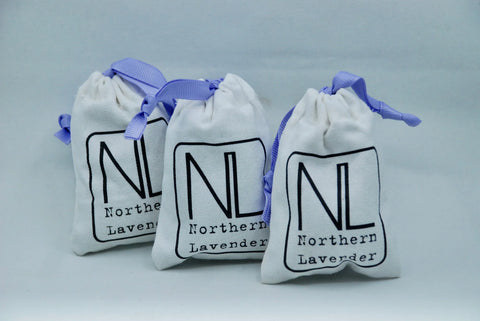 three bags of northern lavender on grey background