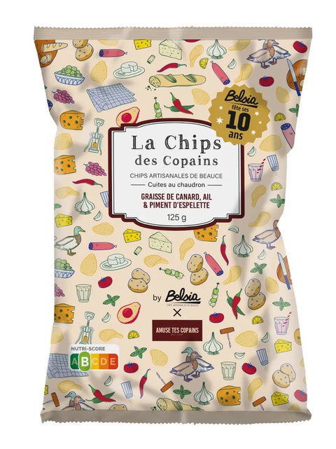A 125g bag of Belvius 'La Chips des Copains' artisanal potato chips. The packaging features a cream-colored background decorated with colorful illustrations of various food items like cheese, garlic, peppers, and wine glasses.