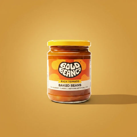 Jar of Bold Beanco baked beans on a beige background