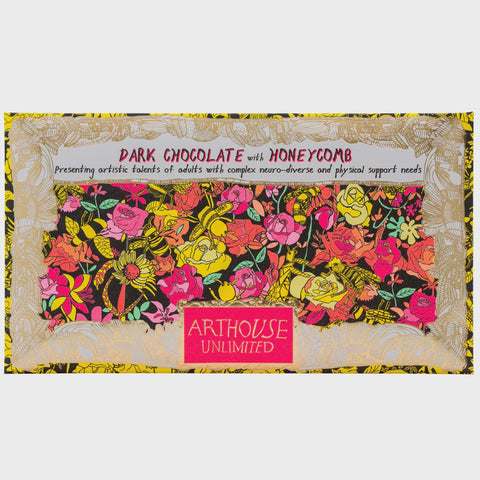 Dark chocolate bar with honeycomb and floral design on a white background