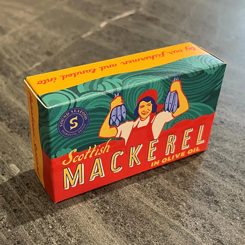 box of scottish mackerel in olive oil on surface