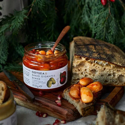 jar of beans on wooden board with bread