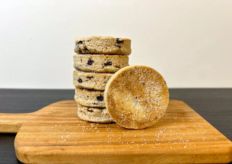 stack of welshcakes on a wooden cutting board