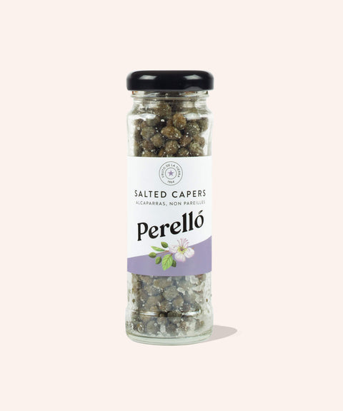 jar of salted capers on white background