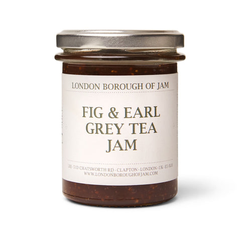 Jar of fig and early grey jam on white background