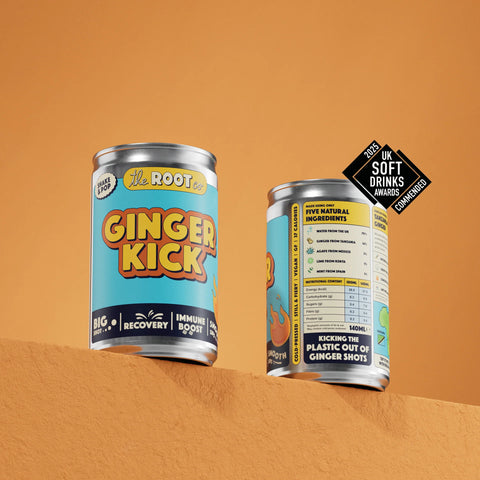 two cans of ginger kick on orange background