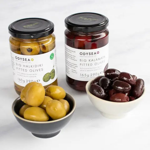 jar of olives with bowls of olives