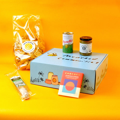 Box of snacks and products with a yellow background