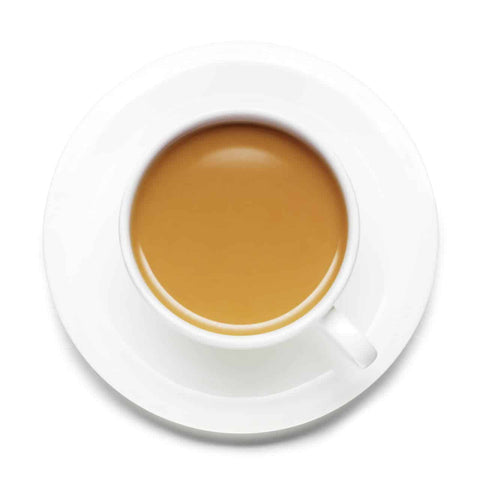 White cup and saucer with a serving of tea on a white background