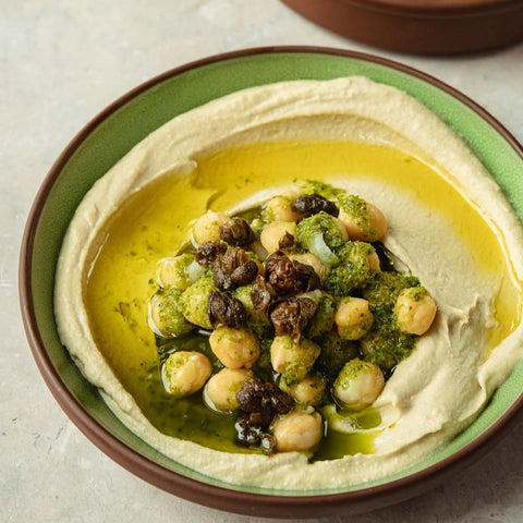 honest toil poured on top of hummus  