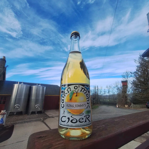 bottle of cairn o'mohr cider on a wooden table