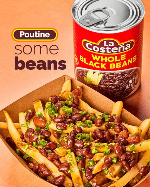 A serving of loaded fries topped with brown beans and chopped green onions, with a can of La Costeña Whole Black Beans and the text 'Poutine some beans' on a warm brown background.