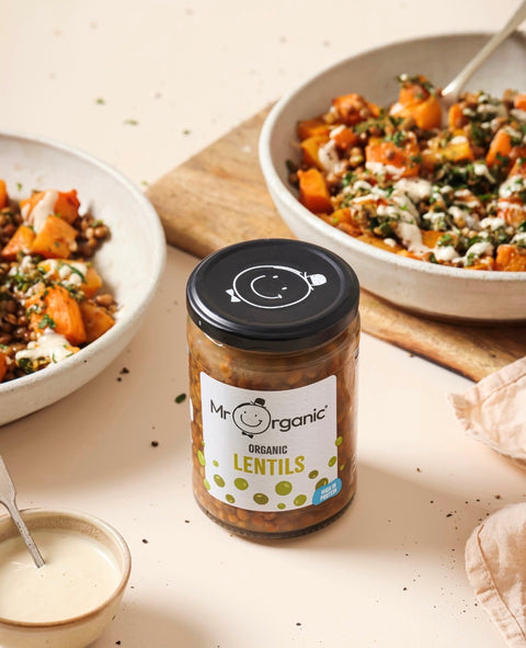 glass jar of Mr Organic Organic Lentils in front of two bowls