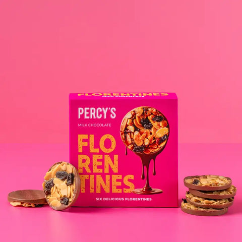 Box of Percy's florentines with biscuits scattered around it
