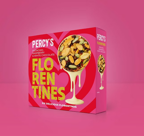 Box of Percy's pistachio, raspberry, and white chocolate florentines on a pink background