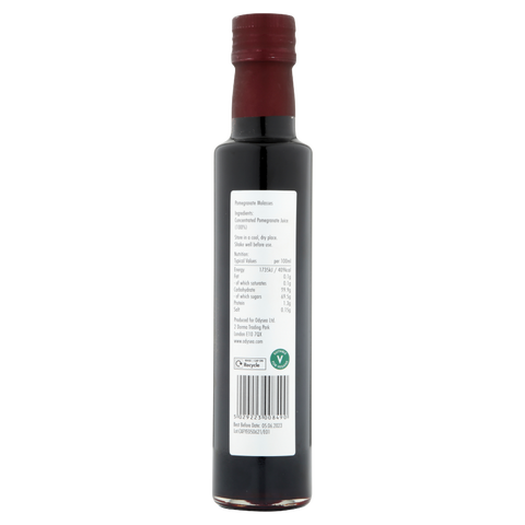 bottle of pomegranate molasses on white background