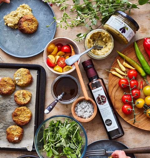 jar of meze with other foods on a wooden table