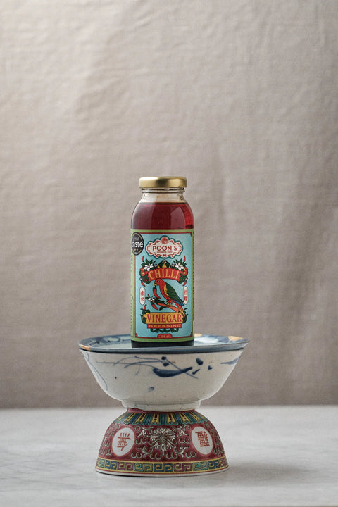 bottle of vinegar on top of stand