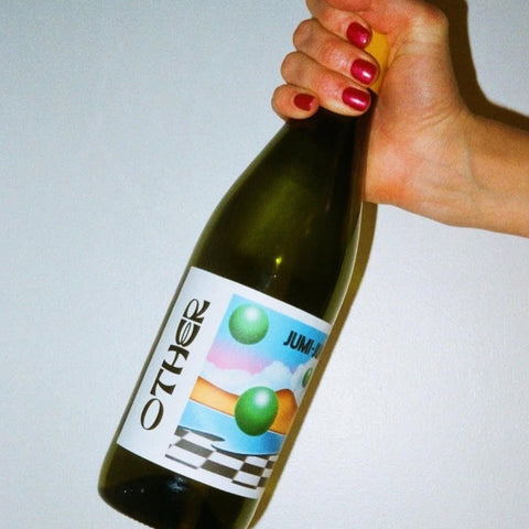 one bottle of jumi-juma 750ml being held
