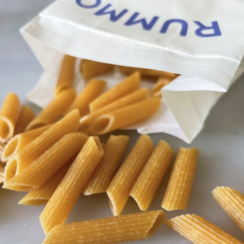 rummo pasta penne rigate N66 500g poured out on a table