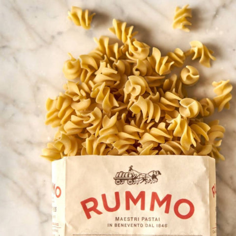 Rummo pasta rummo fusillotti N°155 box with uncooked pasta on a marble surface