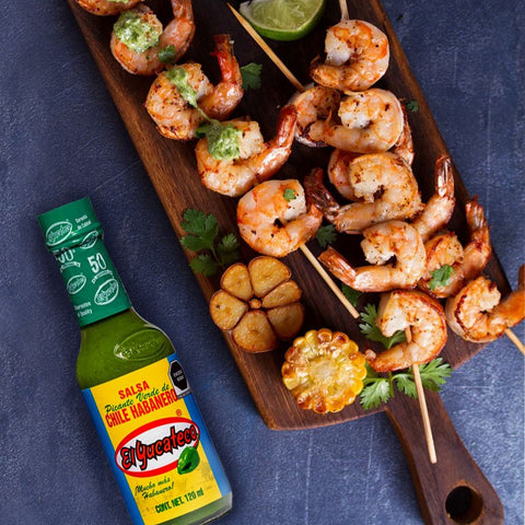 El Yucateco - Habanero Green, Glass Bottle- 120ml on top of shrimp