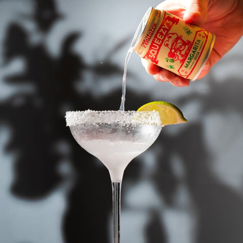 A can of Whitebox Squeezy's Margarita cocktail poured in a margarita glass