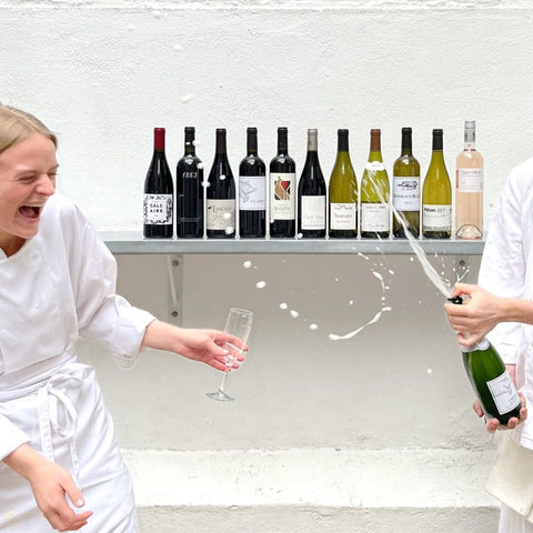 St. JOHN Blanc de Blancs 1er Cru Champagne NV bottle being popped 