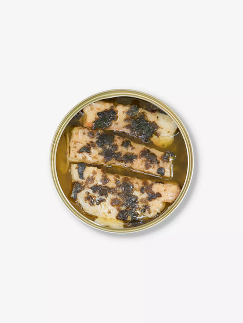 Canned food with fish and black truffle on a white background