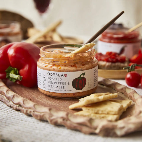 jar of meze next to tomatoes and crackers
