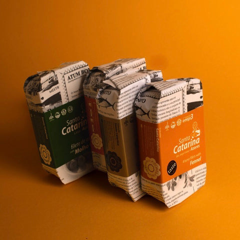 4 tins of santa catarina tunaon yellow background