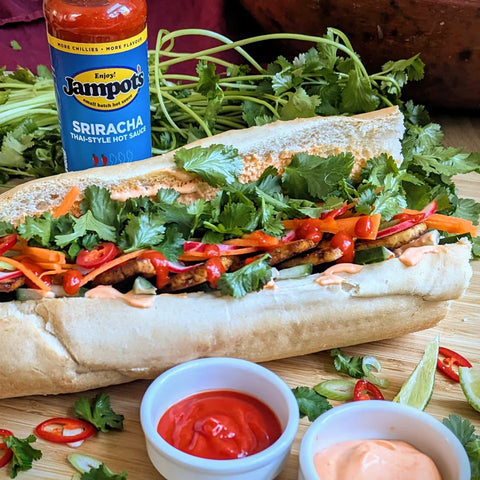 jampots sauce with sandwich and and greens in the foreground