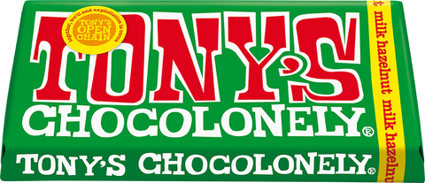 A close-up of a Tony's Chocolonely chocolate bar wrapper, showing the green background, large red and white 'TONY'S' lettering, white 'CHOCOLONELY' text, and a yellow side band reading 'milk hazelnut'.