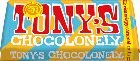 A close-up of a Tony's Chocolonely chocolate bar wrapper with a light blue and yellow background, featuring the brand name 'TONY'S CHOCOLONELY' in large red and white lettering.