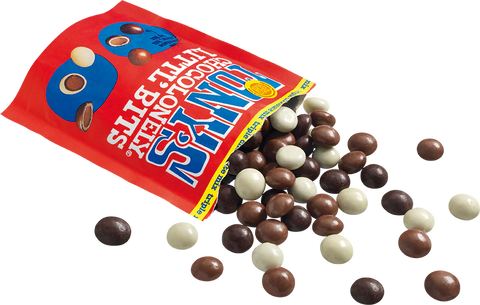 A red bag of Snickersa Chocolate Honey Butter Bits with blue and white branding, shown tipped over with the candy pieces spilling out onto a white background.