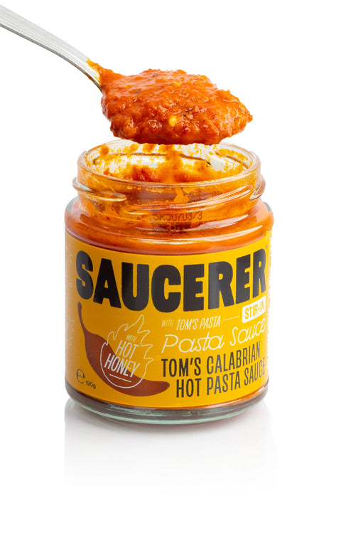 Spoon of hot pasta sauce with hot honey