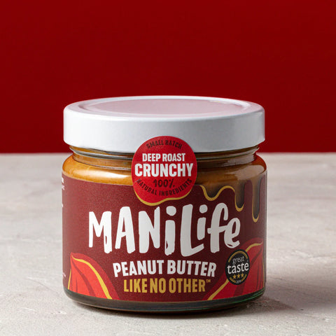 container of deep roast crunchy peanut butter on white surface