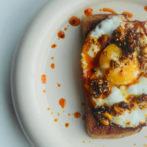 white mausu peanut rayu on eggs and toast