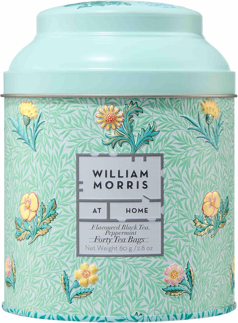 William Morris At Home tea tin featuring a light mint green and white floral pattern with yellow and pink flowers, and a matching mint green lid.