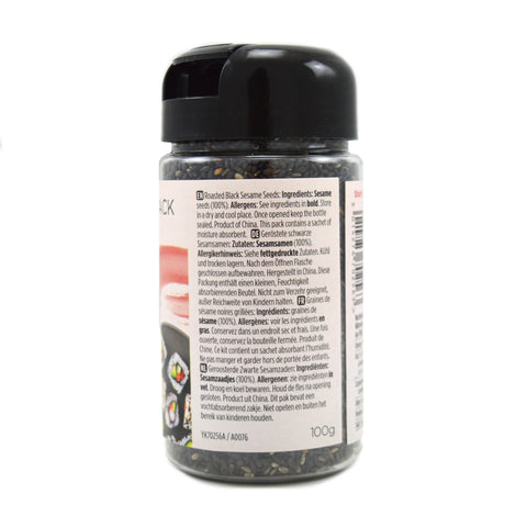 A bottle of natural roasted black sesame seeds, showing the back label and barcode on a white background.