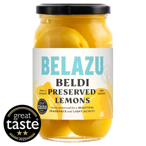 glass jar of Belazu Beldi preserved lemons on white background