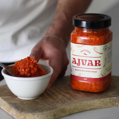 Ajvar being spooned into a bowl