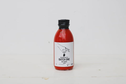 batch one hot sauce from south london with white background